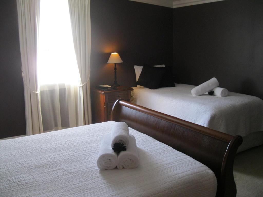 Postel nebo postele na pokoji v ubytování Heritage Guesthouse