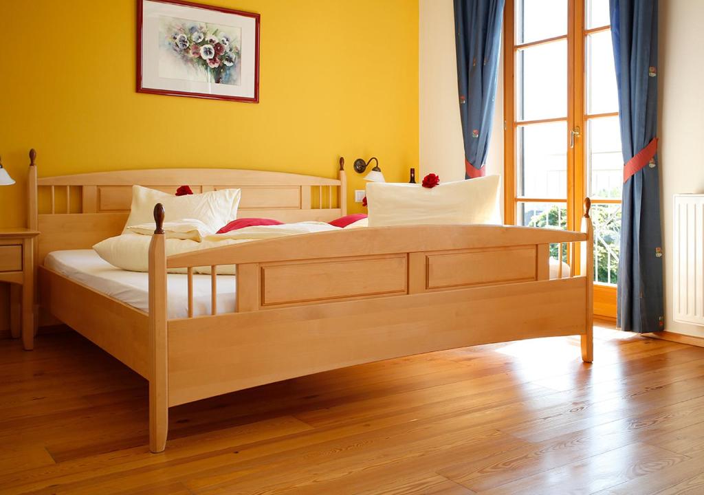 Postel nebo postele na pokoji v ubytování Weingut Winzerhof Gästezimmer Grebenz