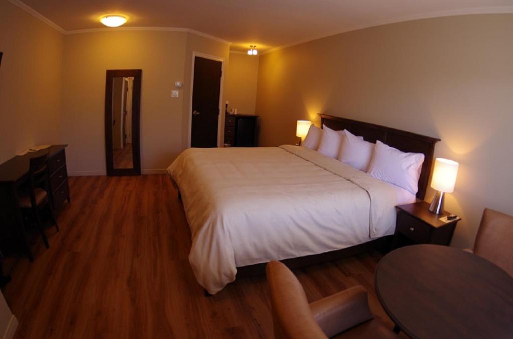 Postel nebo postele na pokoji v ubytování Motel L'Abri