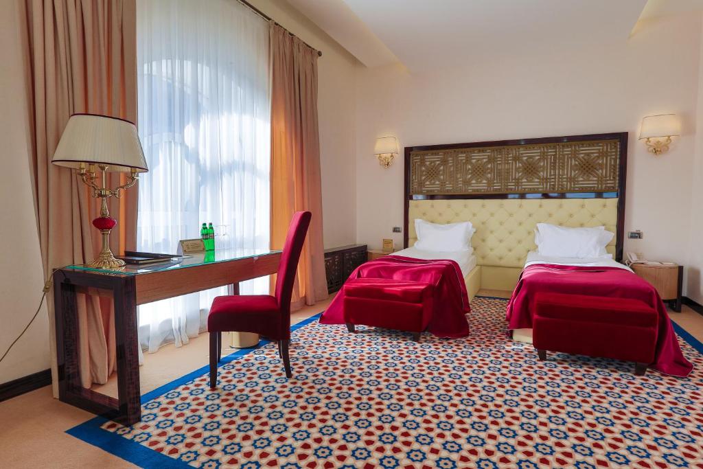 Postel nebo postele na pokoji v ubytování KADORR Hotel Resort & Spa