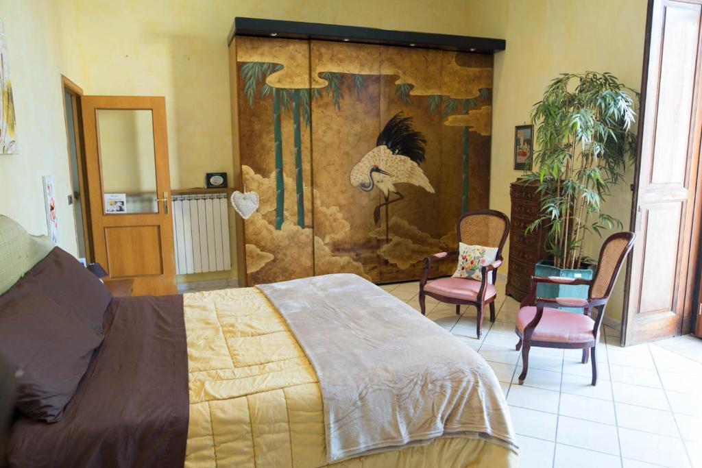 Posteľ alebo postele v izbe v ubytovaní Suite Orchidea by Dimorra