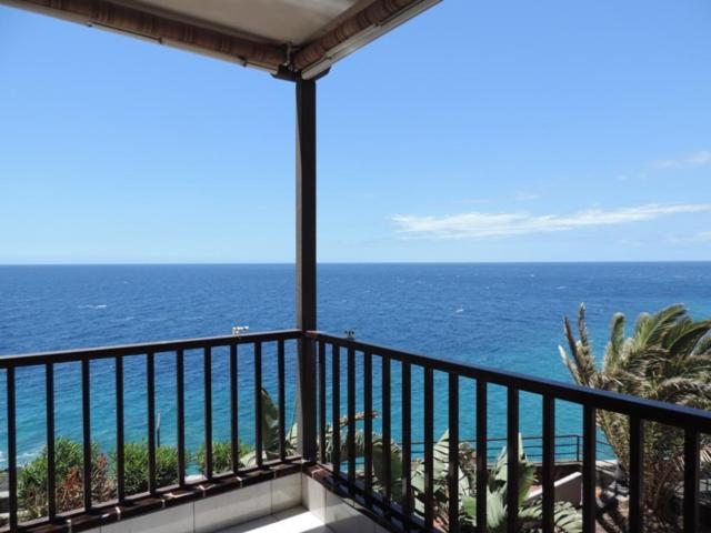 a balcony with a view of the ocean at Balcon del Mar in Costa Del Silencio