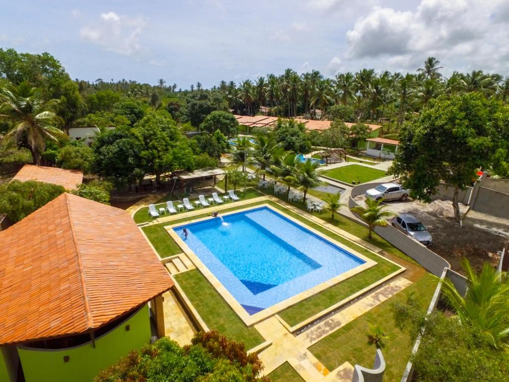 an aerial view of a resort with a swimming pool at Verde Vida Chalés in Conde