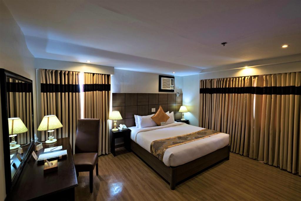 Katil atau katil-katil dalam bilik di The Pinnacle Hotel and Suites