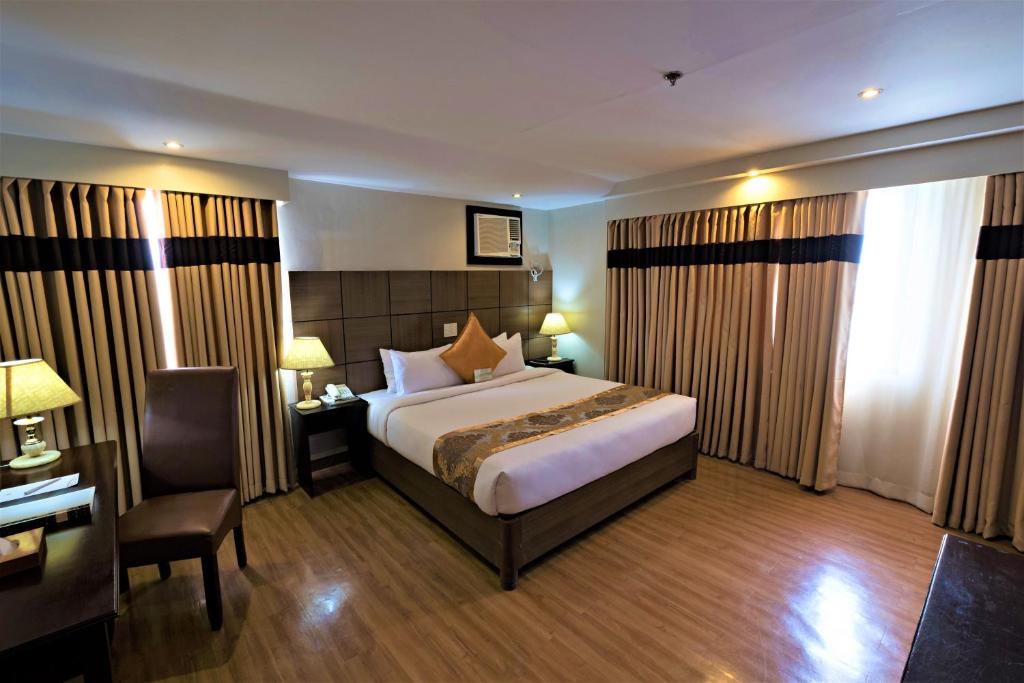 Katil atau katil-katil dalam bilik di The Pinnacle Hotel and Suites