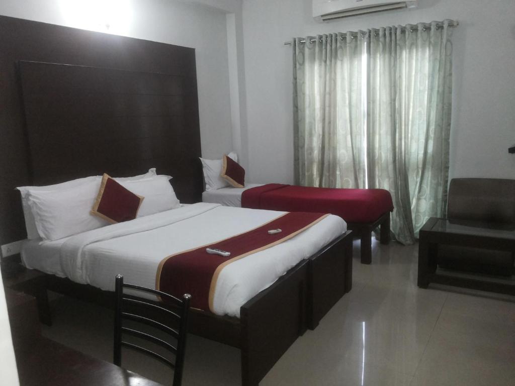 Postel nebo postele na pokoji v ubytování Orion Residency Hotel Near Chennai Central Railway Station