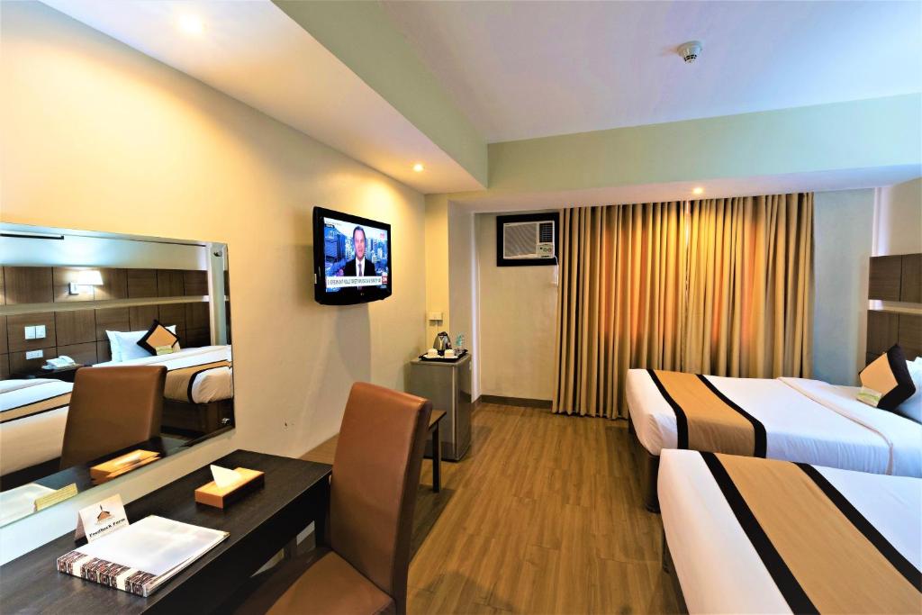 Katil atau katil-katil dalam bilik di The Pinnacle Hotel and Suites