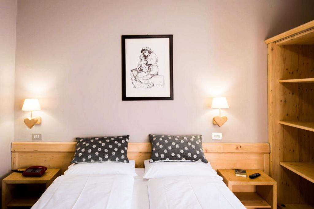 Postel nebo postele na pokoji v ubytování Hotel Vallecetta