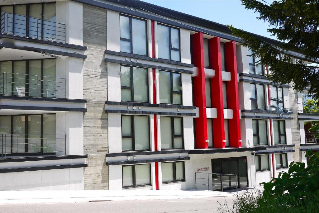 a building with red and white stripes on it at Akazora in Niseko