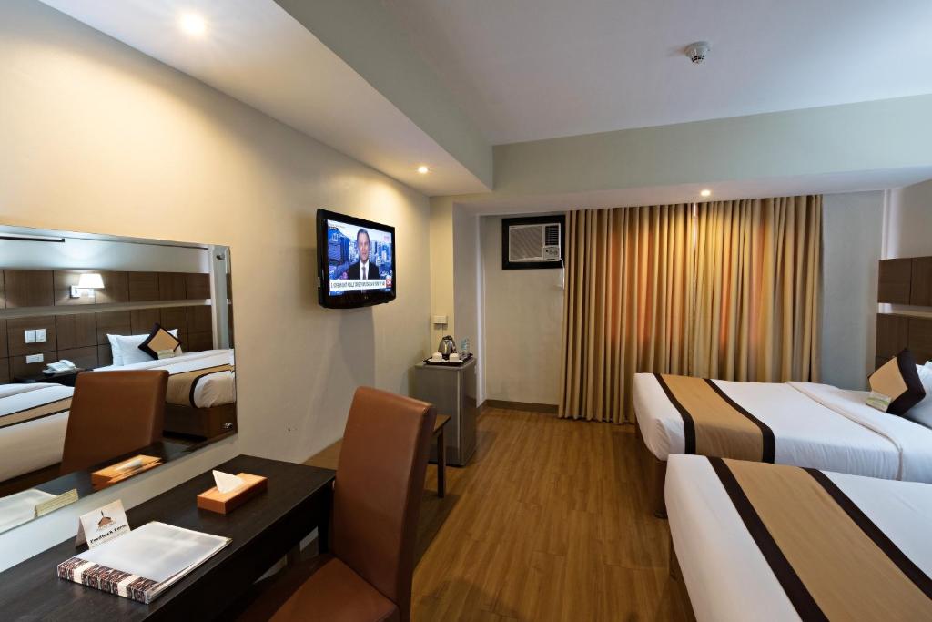 Katil atau katil-katil dalam bilik di The Pinnacle Hotel and Suites