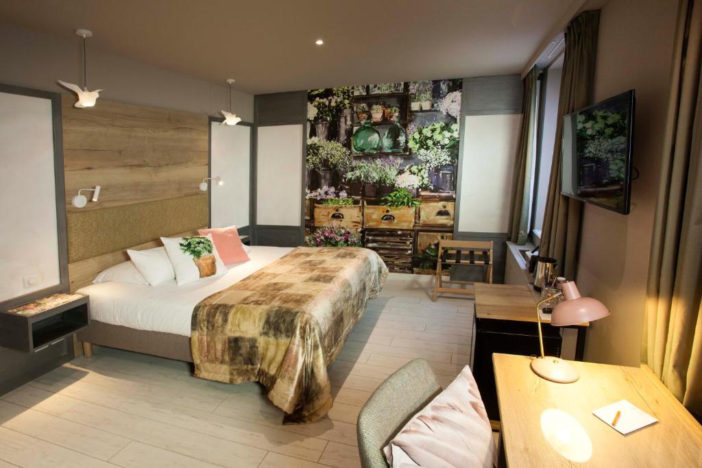Postel nebo postele na pokoji v ubytování Hotel Beaucour