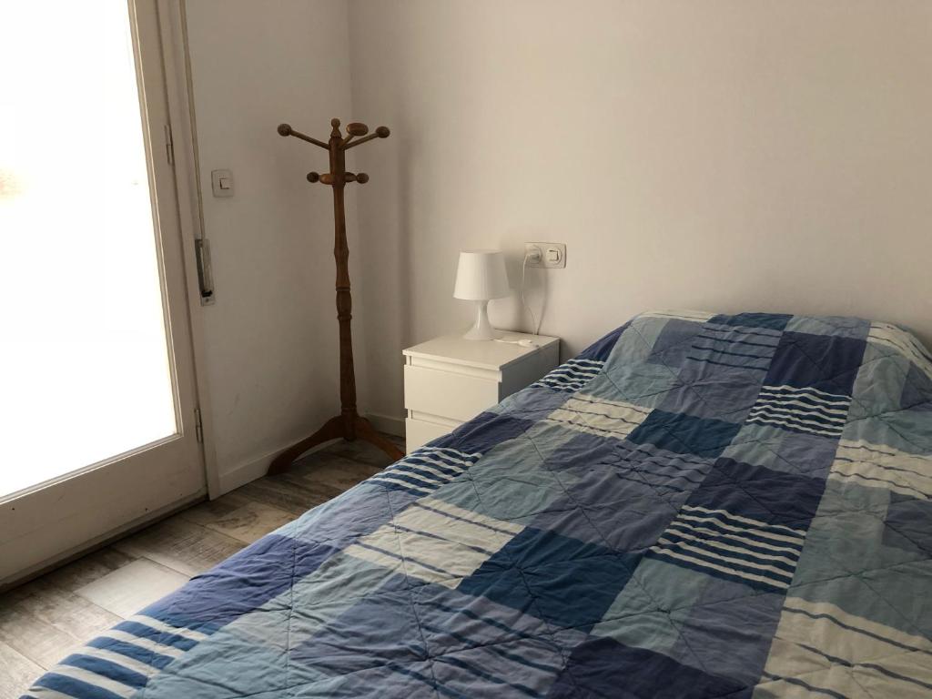 Postel nebo postele na pokoji v ubytování VicAm Atico Duplex