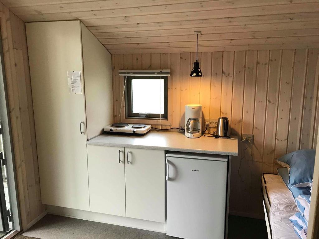 Kuchyň nebo kuchyňský kout v ubytování Sdr. Felding camping & hytteby
