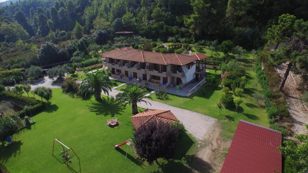 an aerial view of a large house with a yard at Elena Apartments & Studios in Vourvourou