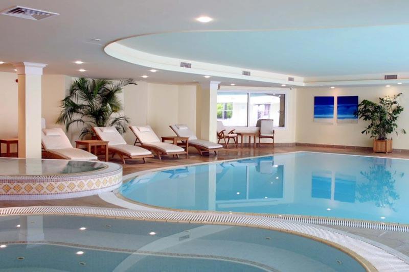 a large swimming pool in a hotel room at Hustyns Resort Cornwall in Wadebridge