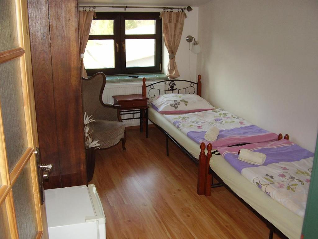 Postel nebo postele na pokoji v ubytování Penzion Večerka