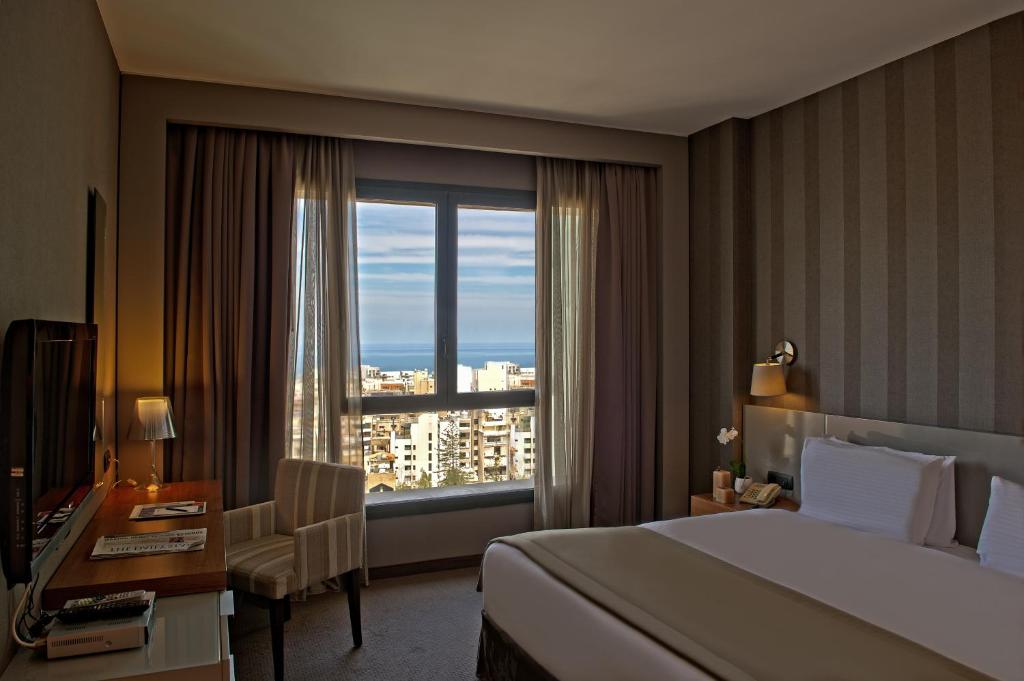 Postel nebo postele na pokoji v ubytování ParkTower Suites