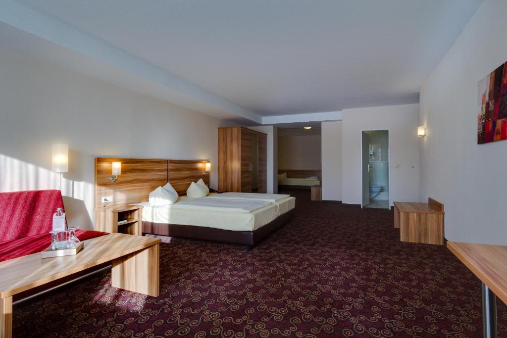 Ένα ή περισσότερα κρεβάτια σε δωμάτιο στο Ferien Hotel Rennsteigblick