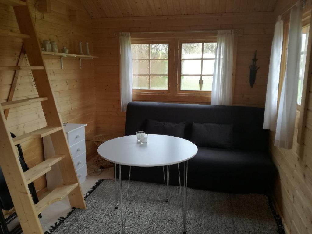 Posezení v ubytování Hjemstavnsgårdens Camping & Cottages