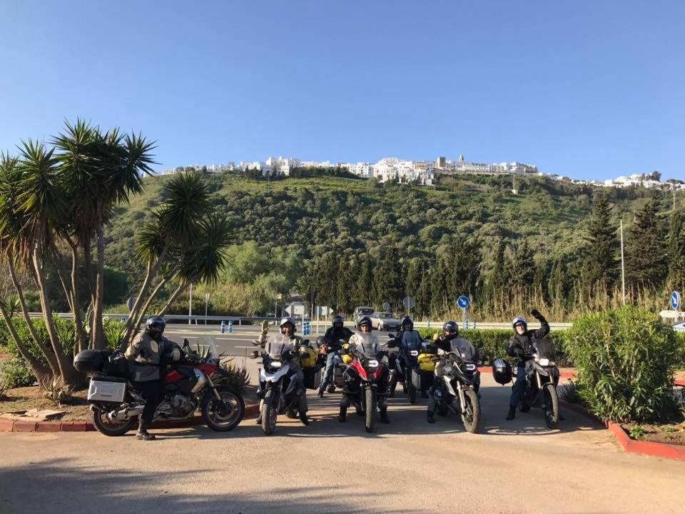 a group of people riding motorcycles on a road at Hotel El Paso in Vejer de la Frontera