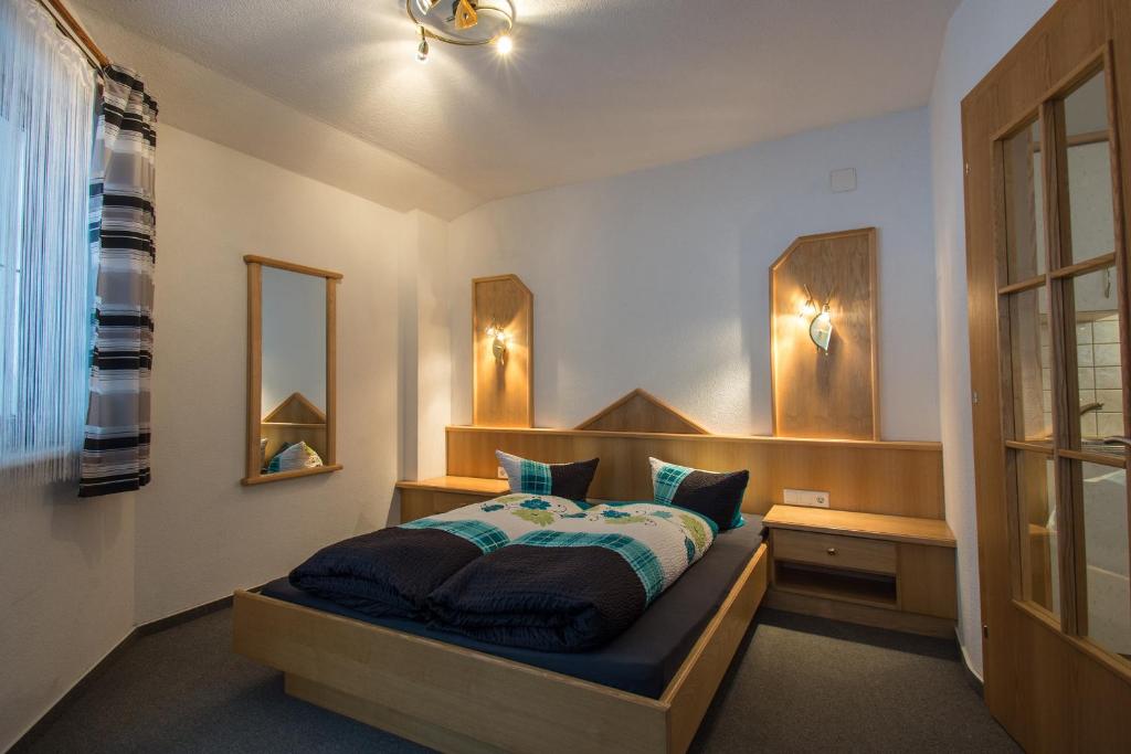 Postel nebo postele na pokoji v ubytování Haus Dorfschmied