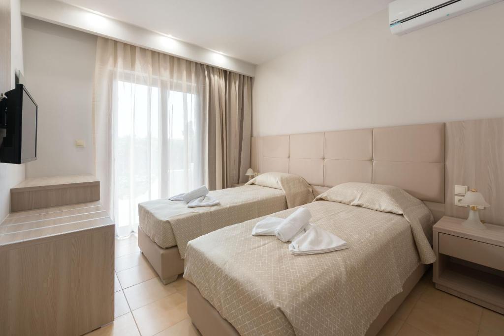 Postel nebo postele na pokoji v ubytování Saint George Resort