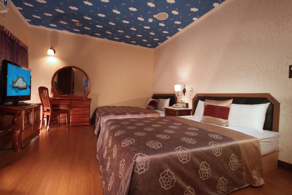 Postel nebo postele na pokoji v ubytování Shinyes Motel