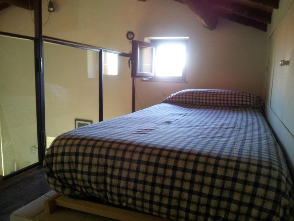 A bed or beds in a room at Bicoca - Casaletti