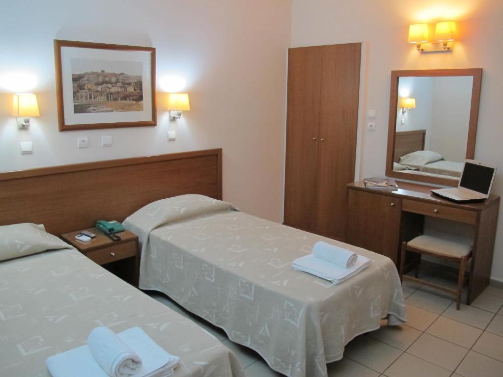 Postel nebo postele na pokoji v ubytování Hotel Solomou Athens