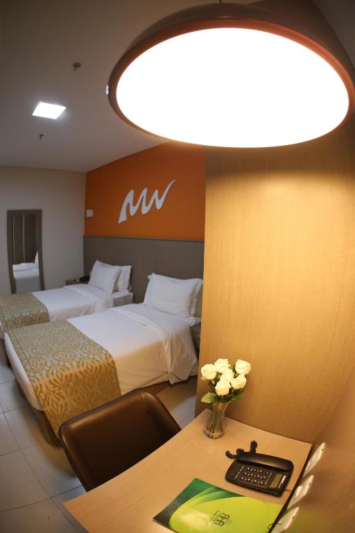 Cama ou camas em um quarto em Real Classic Bahia Hotel