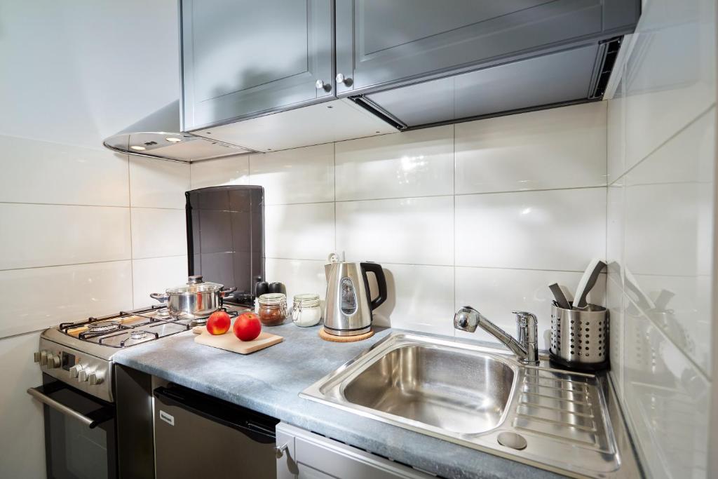 Kuchyňa alebo kuchynka v ubytovaní Marszałkowska Apartament