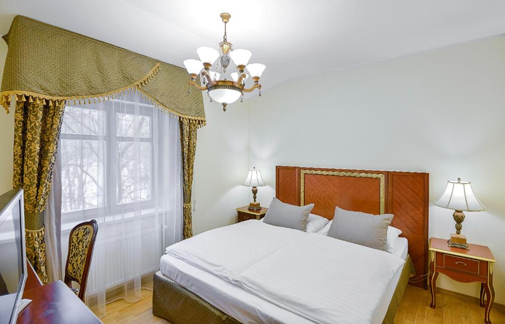 Postel nebo postele na pokoji v ubytování Residence Romanza