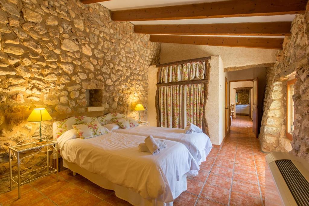 Postel nebo postele na pokoji v ubytování Sa Pobla 218428