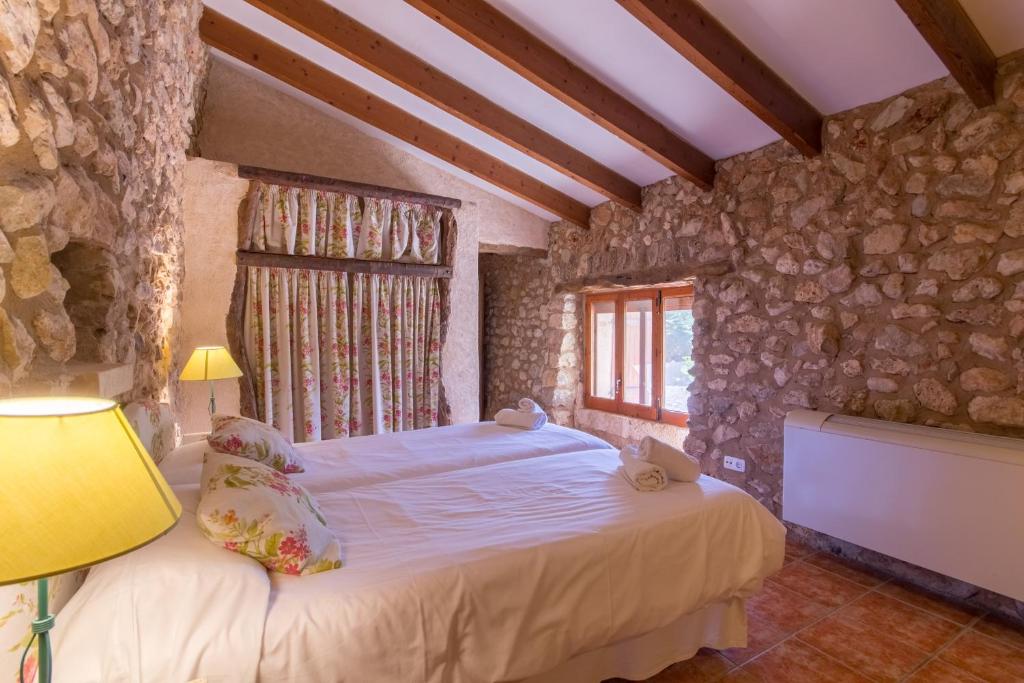 Postel nebo postele na pokoji v ubytování Sa Pobla 218428