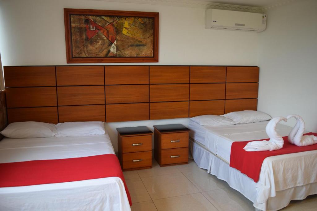 Postel nebo postele na pokoji v ubytování Hotel Apart Guayaquil Aeropuerto