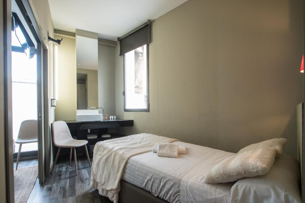 A bed or beds in a room at Cosy Rooms Bolsería