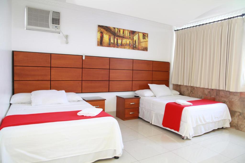 Postel nebo postele na pokoji v ubytování Hotel Apart Guayaquil Aeropuerto