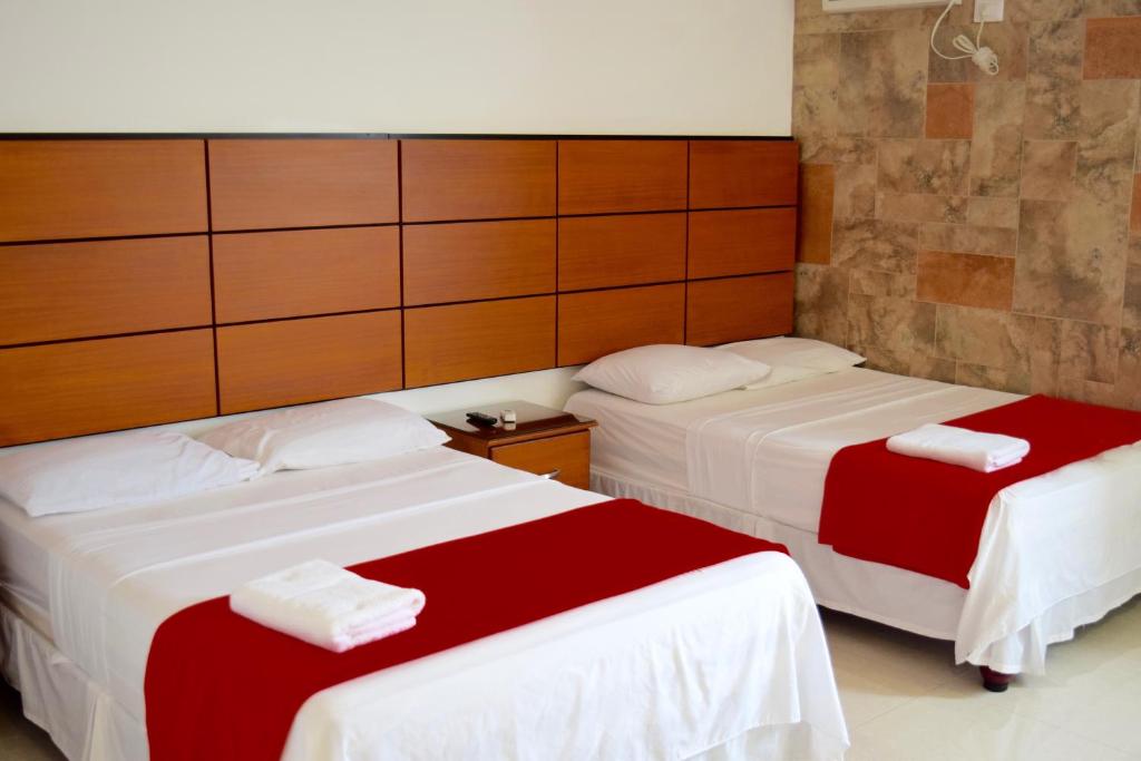 Postel nebo postele na pokoji v ubytování Hotel Apart Guayaquil Aeropuerto