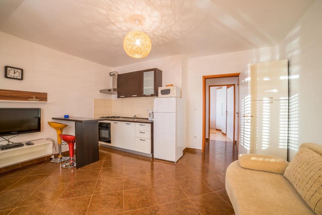 Kuchyň nebo kuchyňský kout v ubytování Apartments Jakovčev