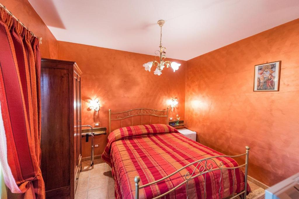 Postel nebo postele na pokoji v ubytování Locanda del Borgo