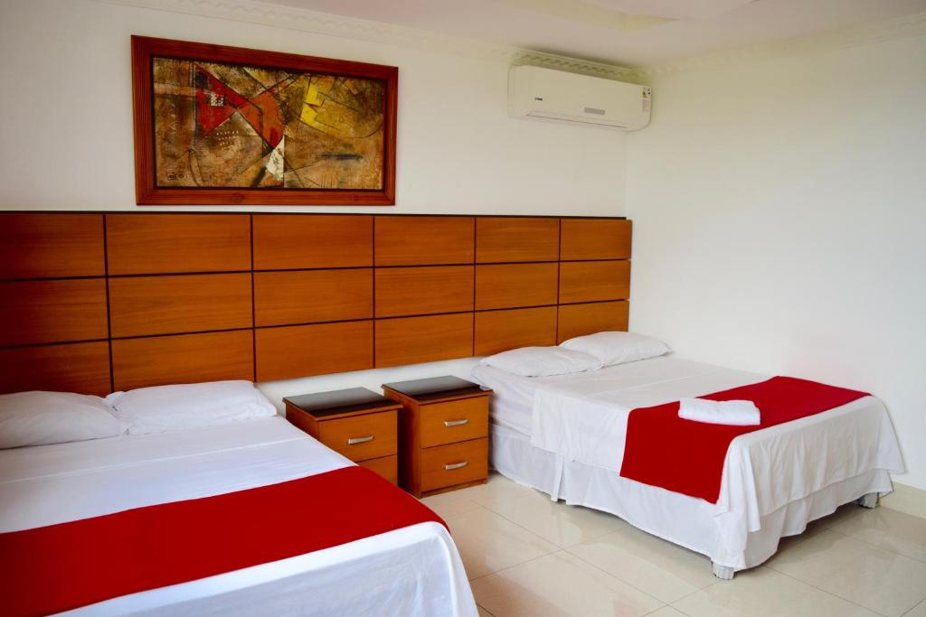 Postel nebo postele na pokoji v ubytování Hotel Apart Guayaquil Aeropuerto