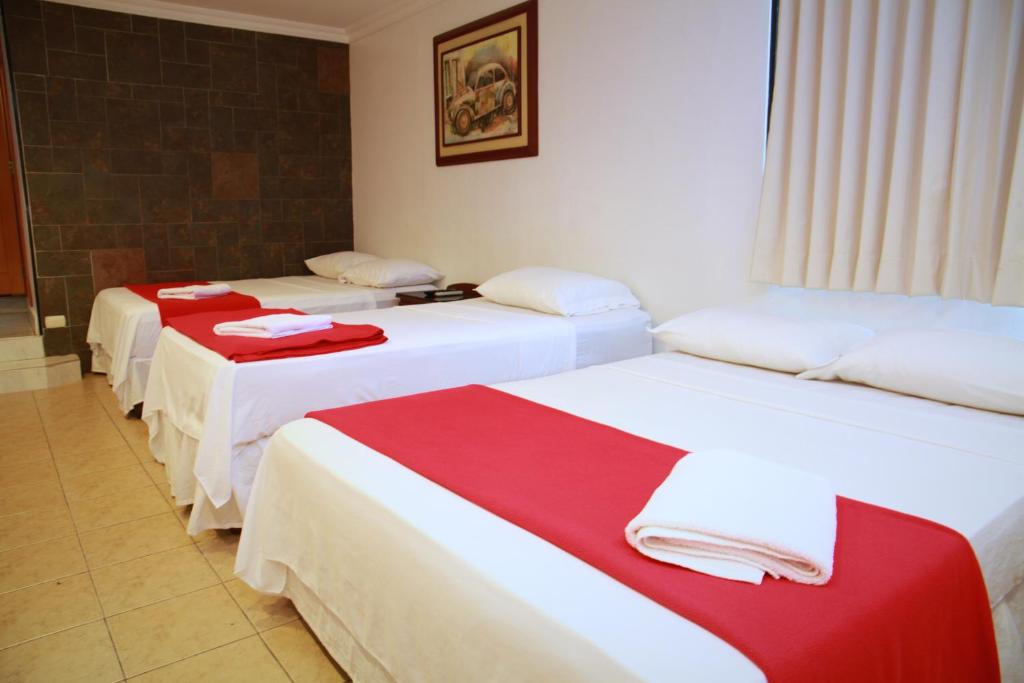 Postel nebo postele na pokoji v ubytování Hotel Apart Guayaquil Aeropuerto