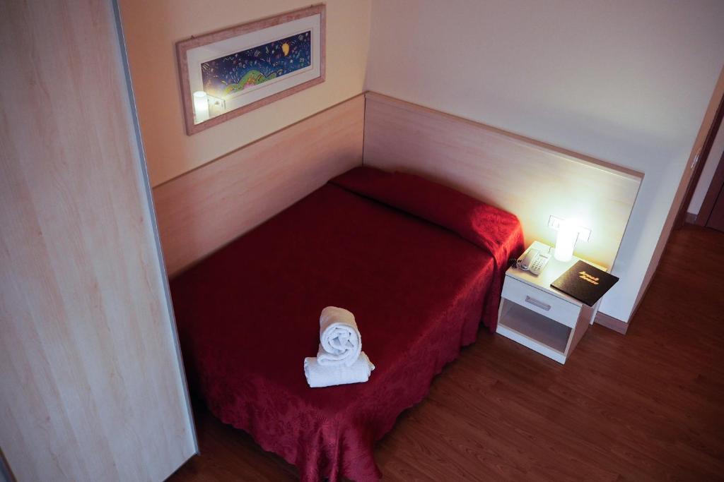 Postel nebo postele na pokoji v ubytování Hotel Break House Ristorante