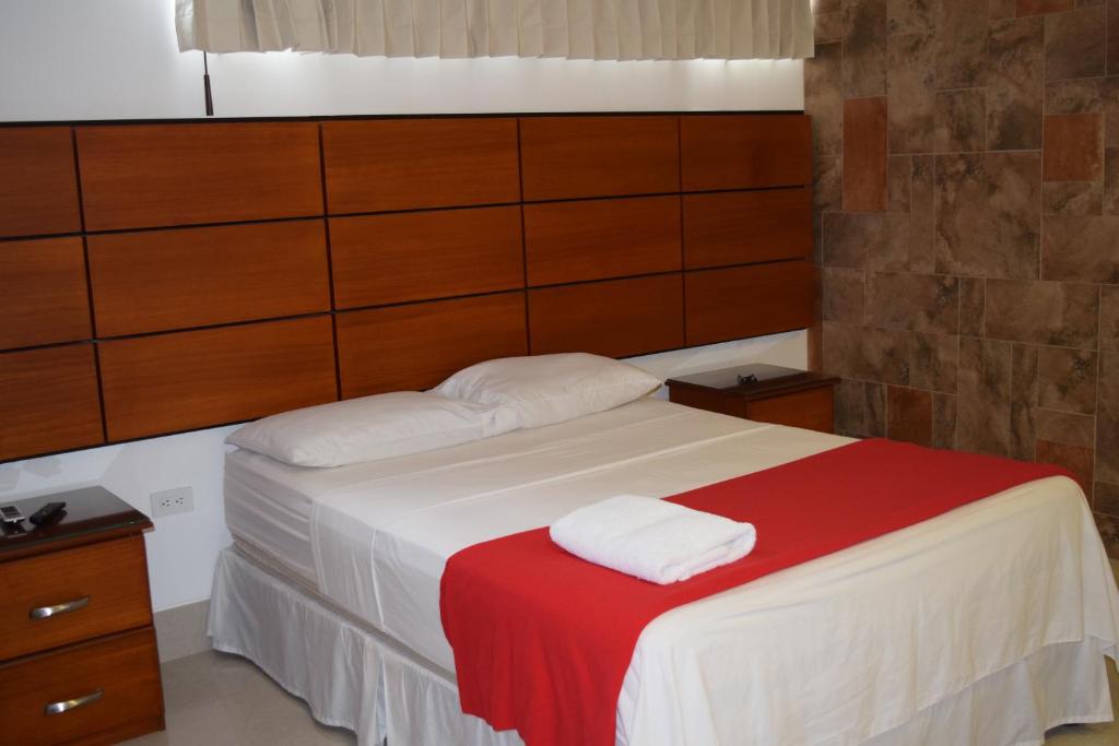 Postel nebo postele na pokoji v ubytování Hotel Apart Guayaquil Aeropuerto