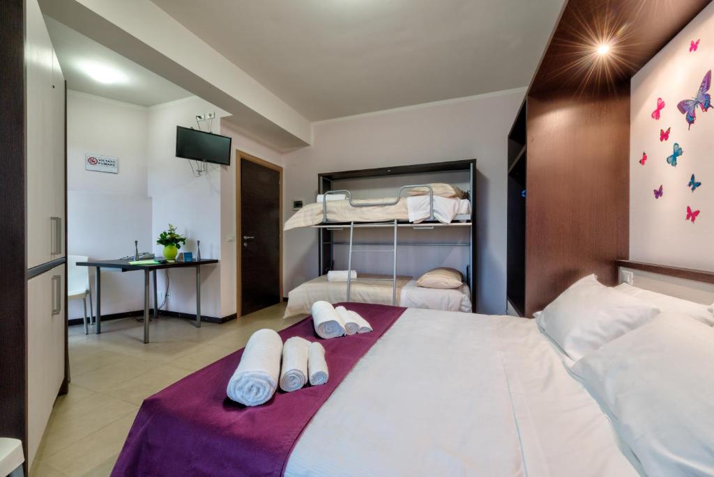 Łóżko lub łóżka w pokoju w obiekcie AppartaHotel