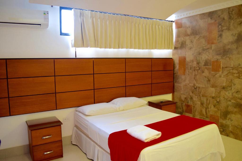 Postel nebo postele na pokoji v ubytování Hotel Apart Guayaquil Aeropuerto
