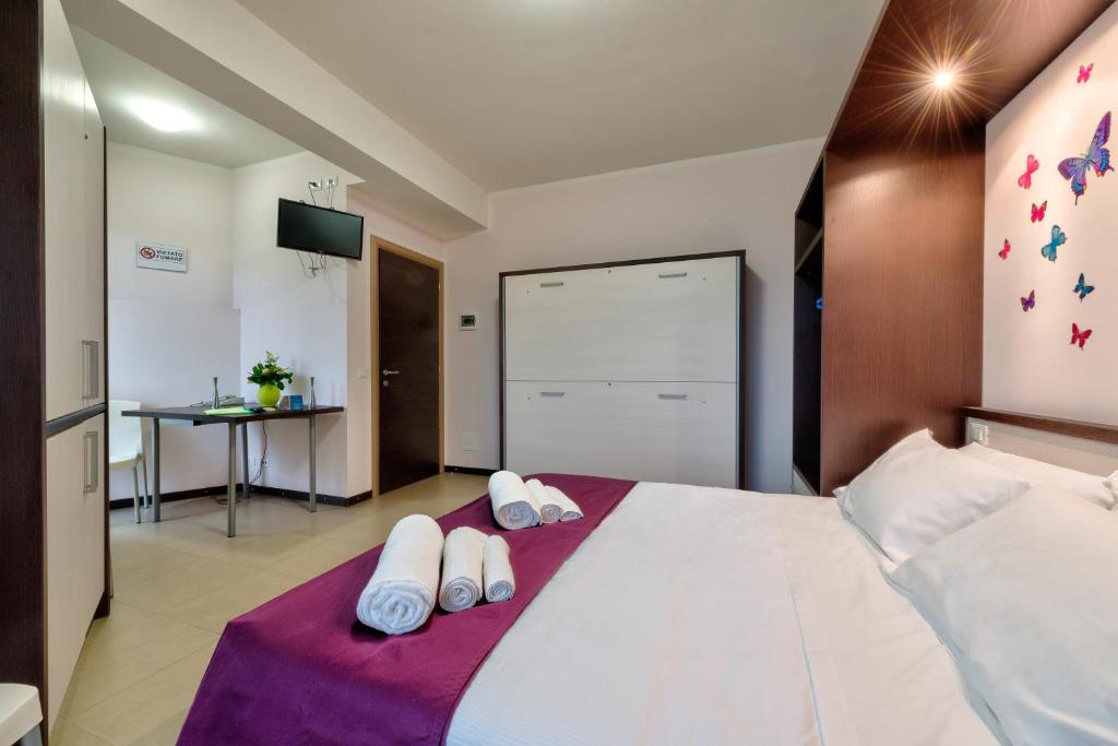Łóżko lub łóżka w pokoju w obiekcie AppartaHotel