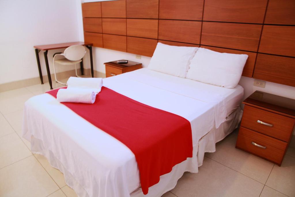 Postel nebo postele na pokoji v ubytování Hotel Apart Guayaquil Aeropuerto
