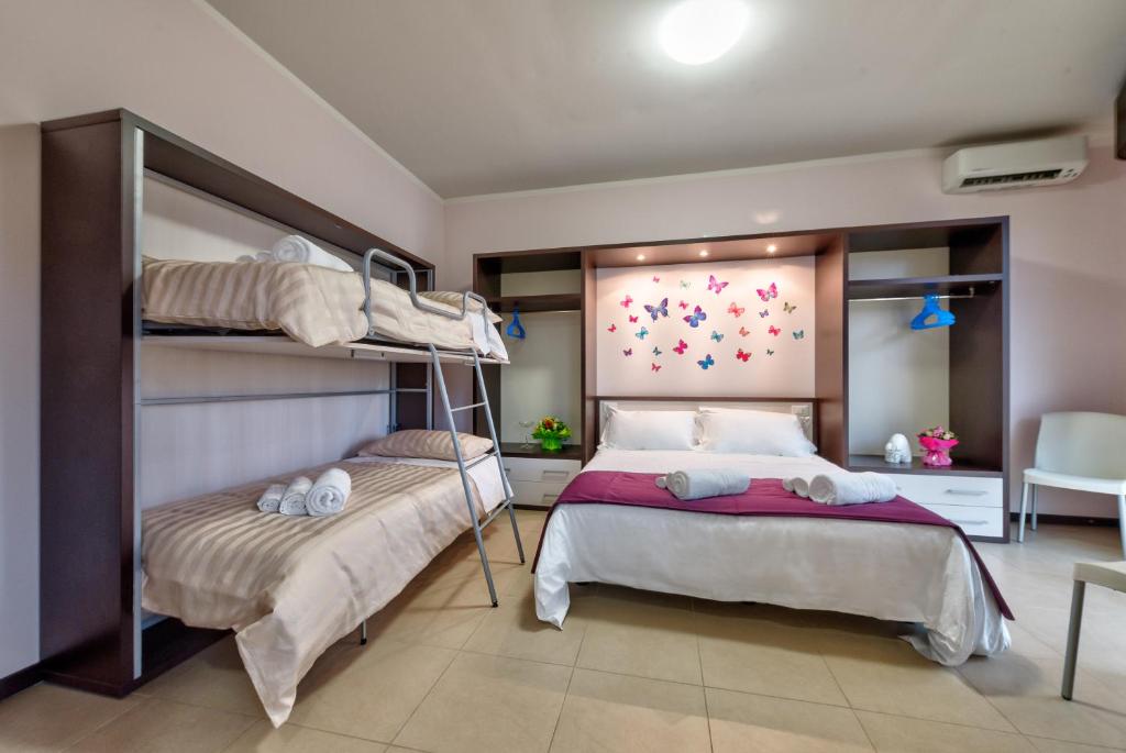 Łóżko lub łóżka w pokoju w obiekcie AppartaHotel