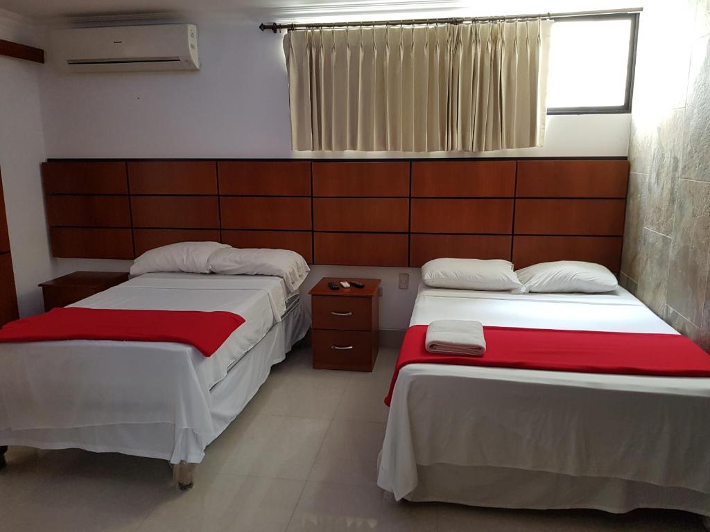 Postel nebo postele na pokoji v ubytování Hotel Apart Guayaquil Aeropuerto